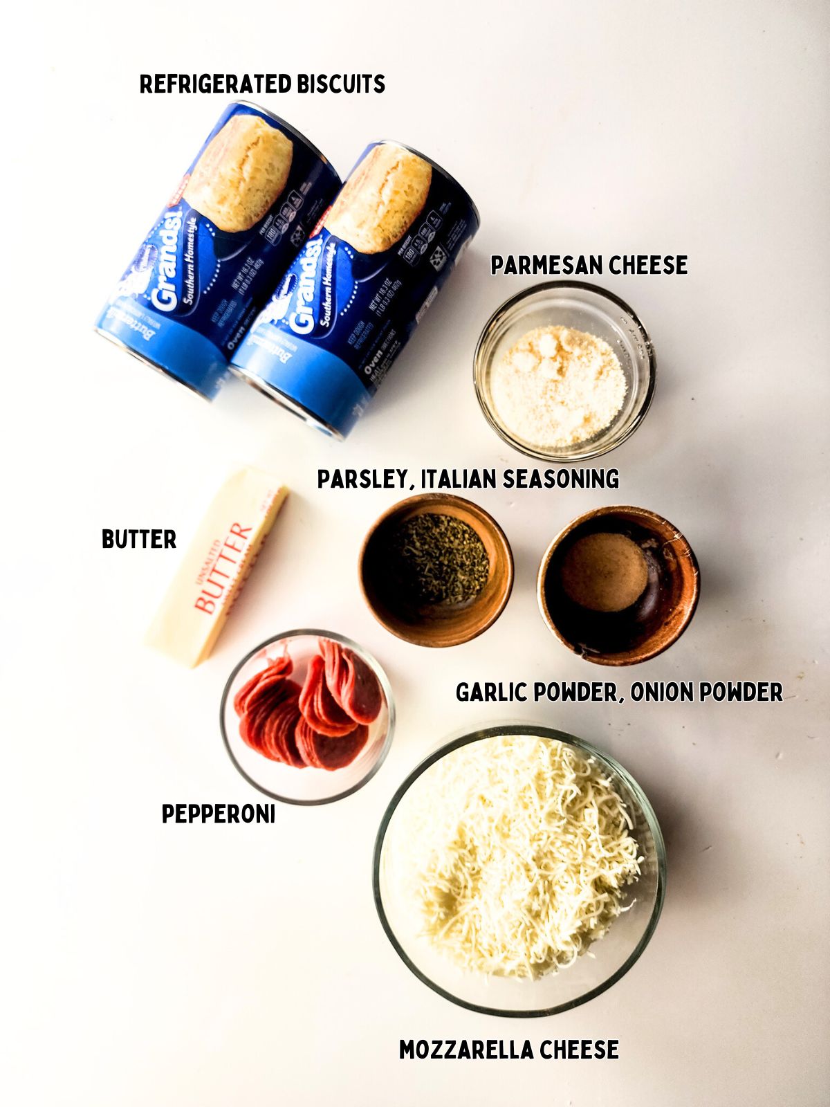 Ingredients for savory pizza monkey bread made in bundt pan.