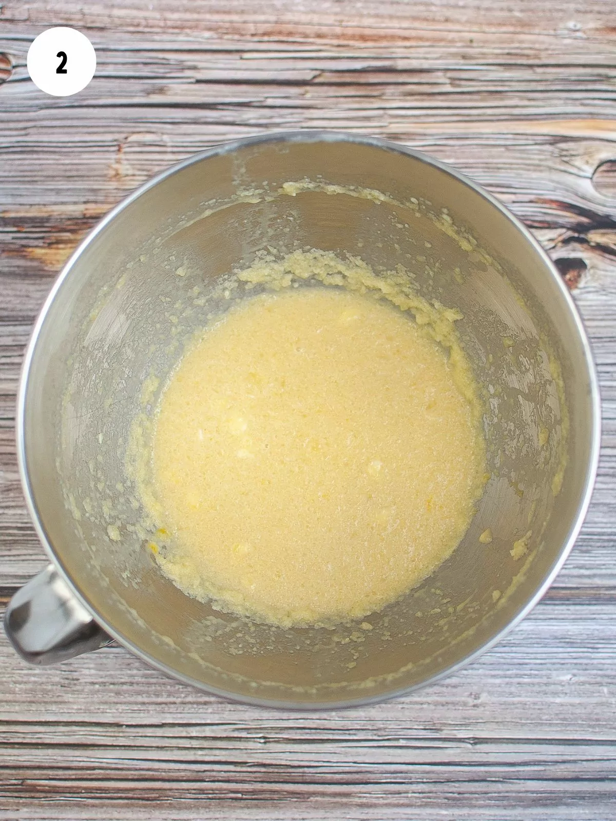 melted butter and sugar mixed in stainless steel bowl