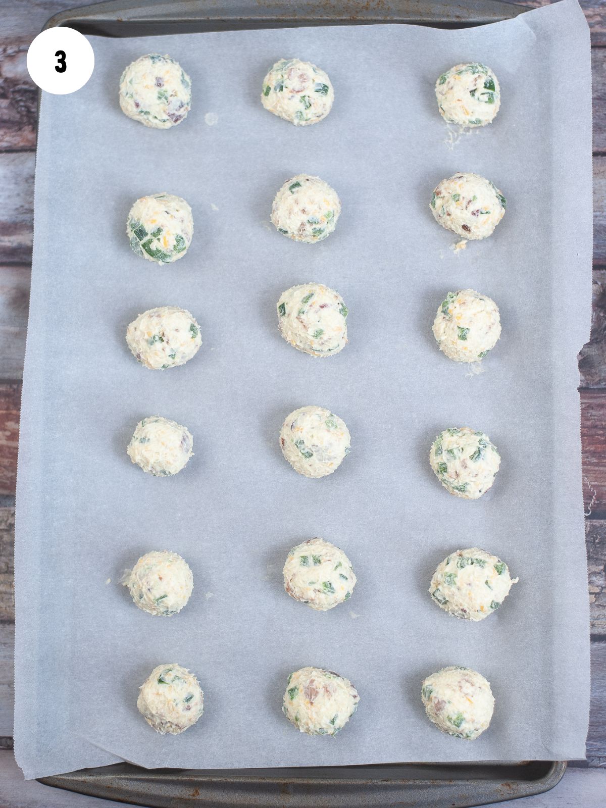 balls of the cheese mixture on a parchment lined baking sheet