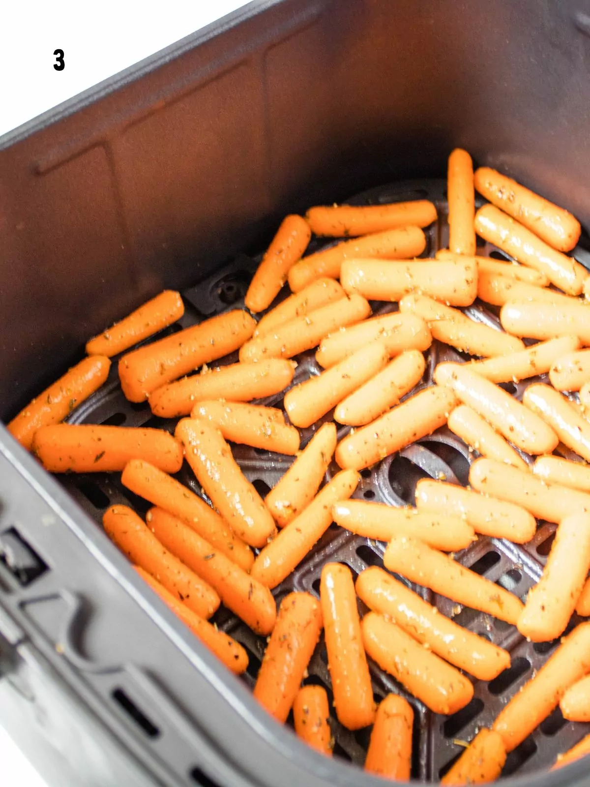 seasoned baby carrots in air fryer basket