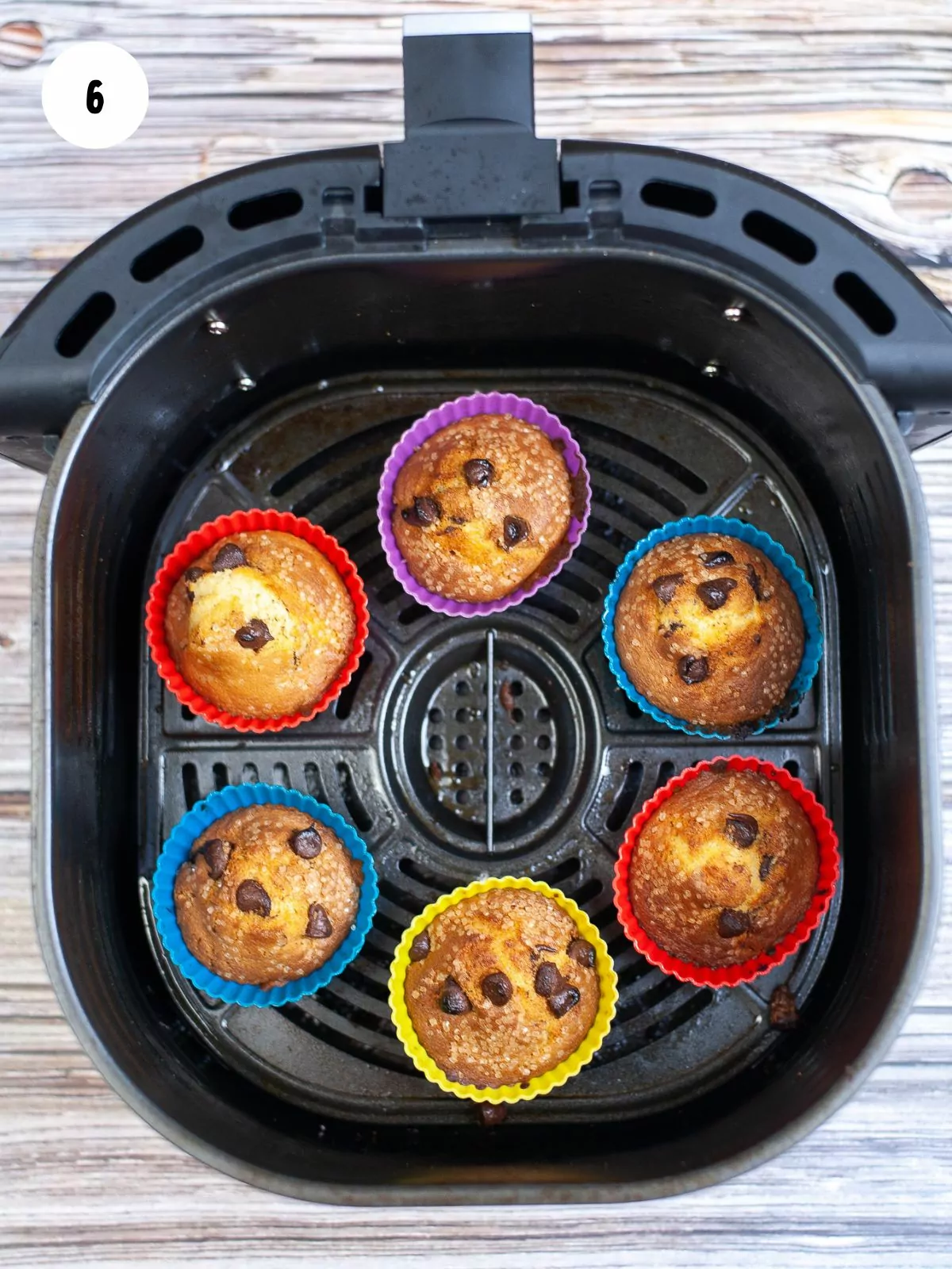 Baked muffins in an air fryer basket