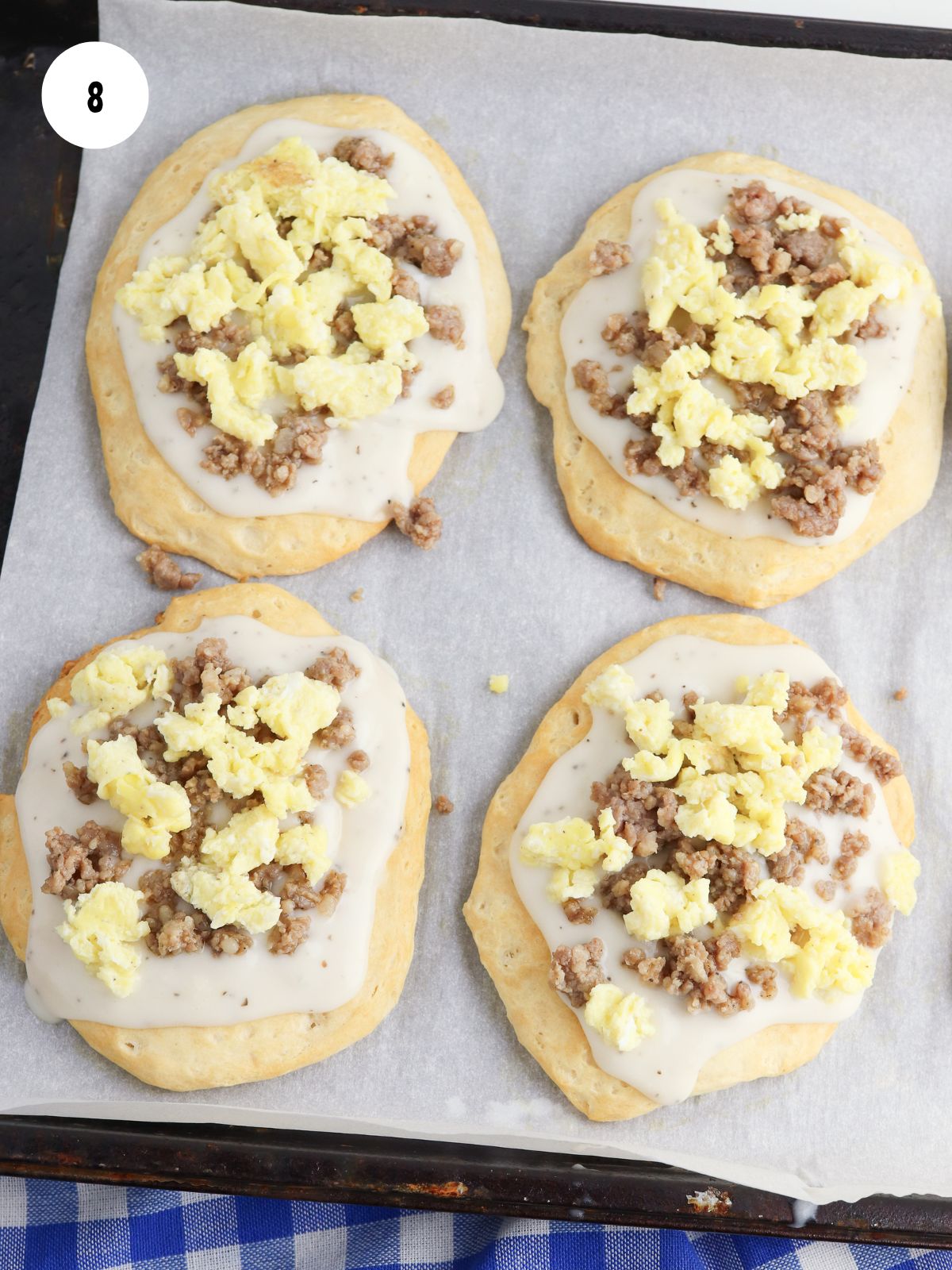 scrambled egg added on top of the sausage and gravy