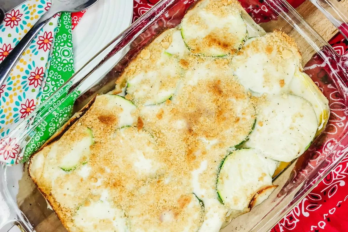 zucchini casserole with cracker crumbs baked in casserole dish.
