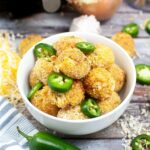 Bowl of Air Fryer Jalapeno Poppers with fresh jalapeno slices