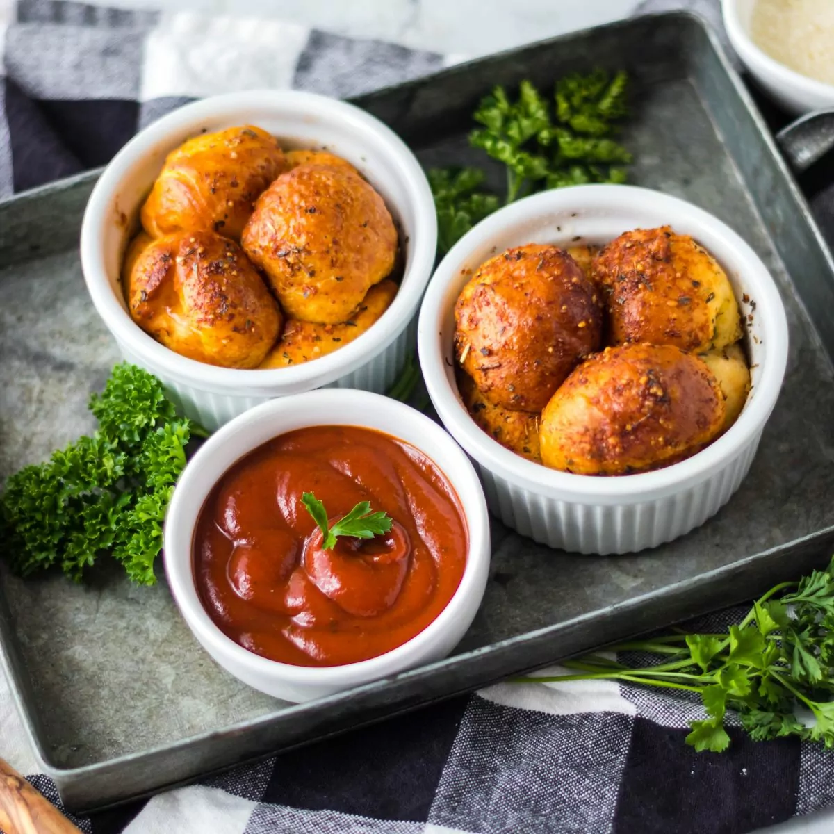 Air Fryer Pull Apart Pizza Bread in white ramekins served with a bowl of marinara