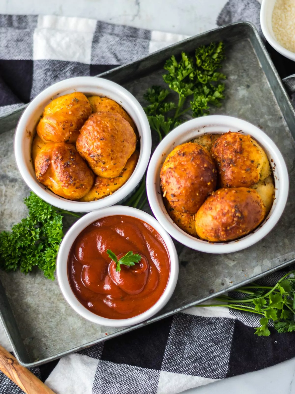 Air Fryer Pull Apart Pizza Bread served in white ramekins with a bowl of marinara