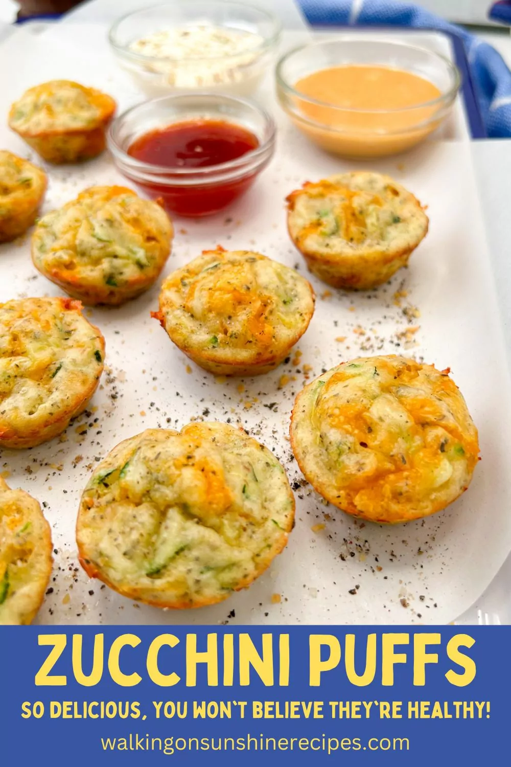 zucchini mini muffins on plate with dipping sauces.