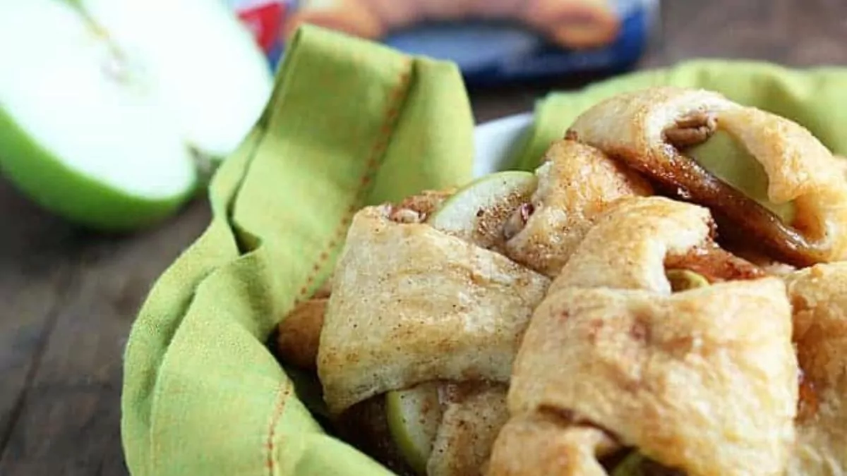 a bowl of apple pie bites made with crescent dough.