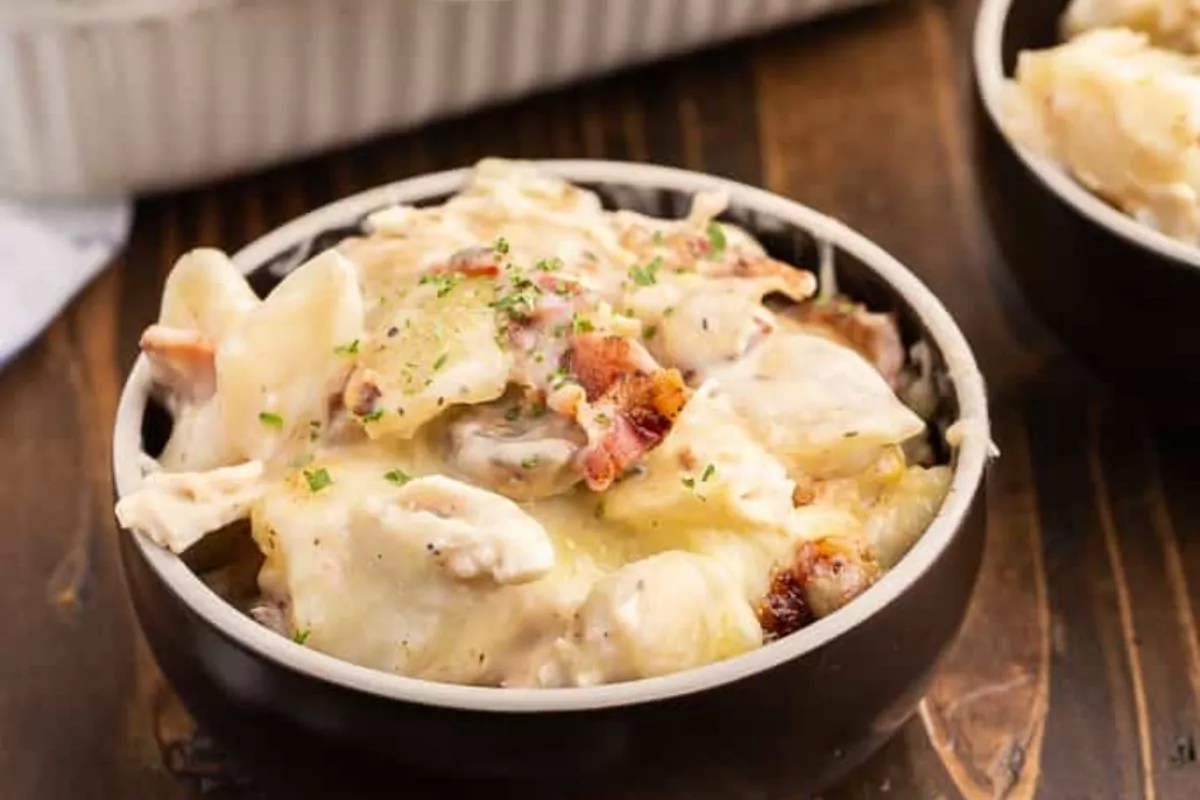 a casserole made of chicken, mushroom and alfredo with pierogi.