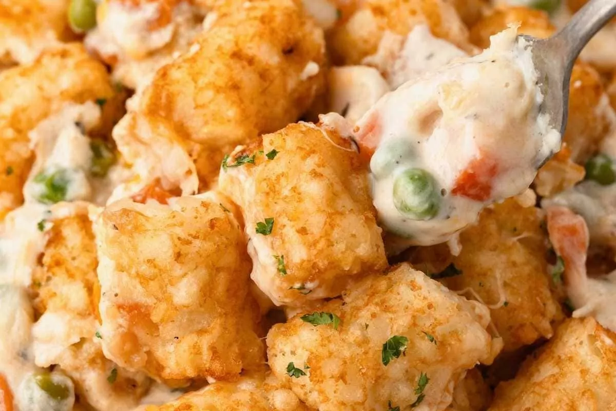 a fork scooping up tater tot chicken casserole.