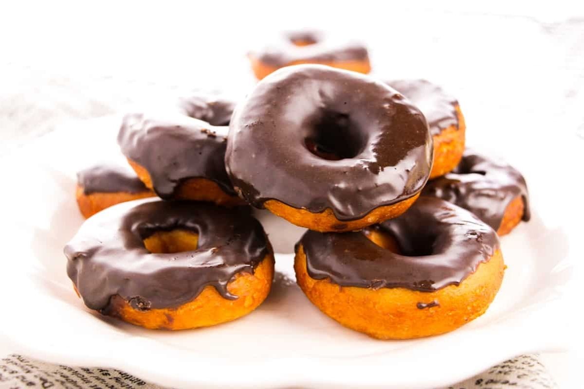 a stack of chocolate glazed donuts.