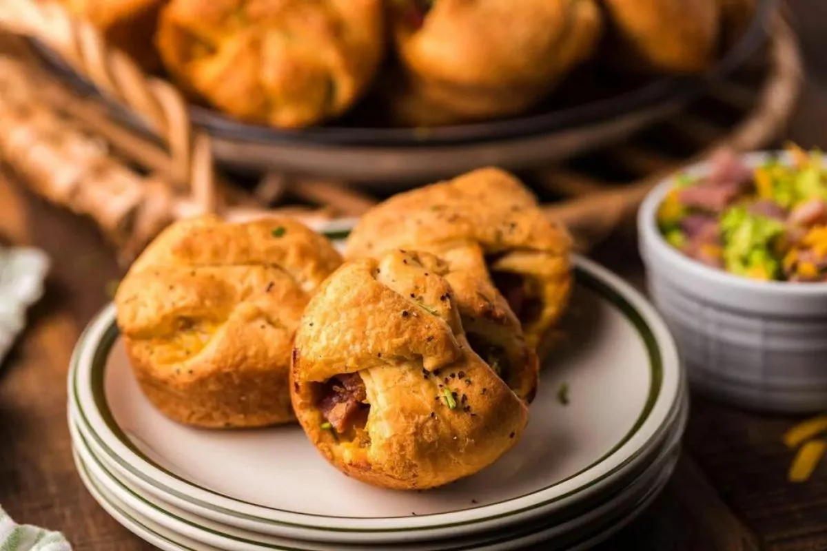 a plate of ham, broccoli and cheese stuffed crescent rolls.