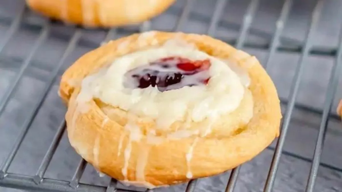 Mini crescent roll danishes topped with cherry cheesecake.