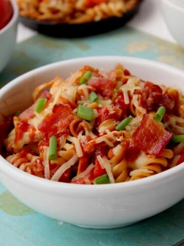 bowl of chicken, pasta, cheese and bacon.