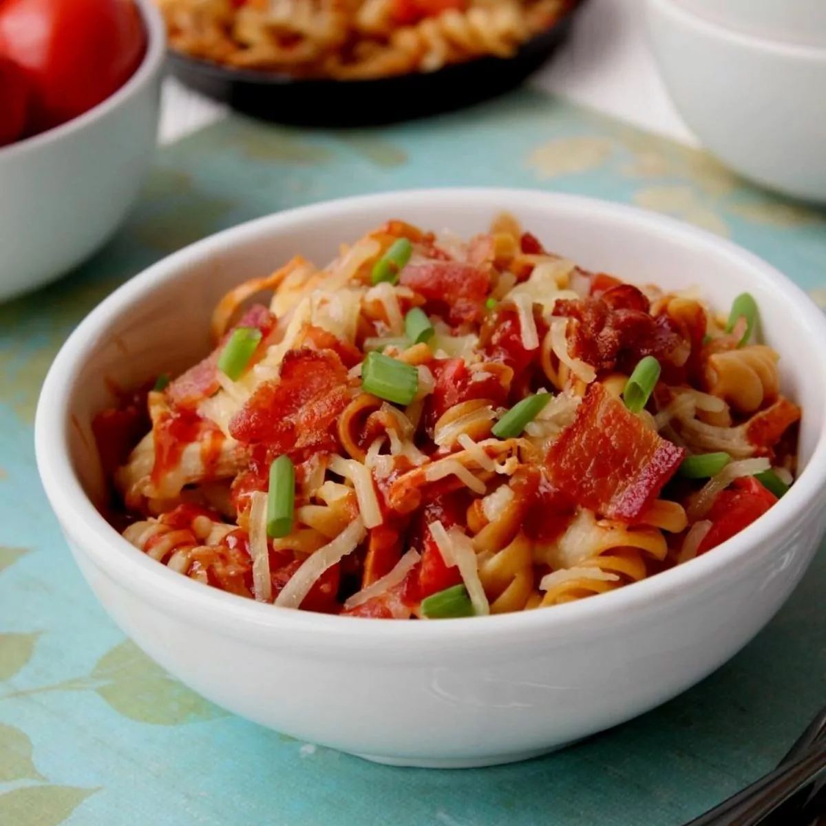 bowl of chicken, pasta, cheese and bacon.