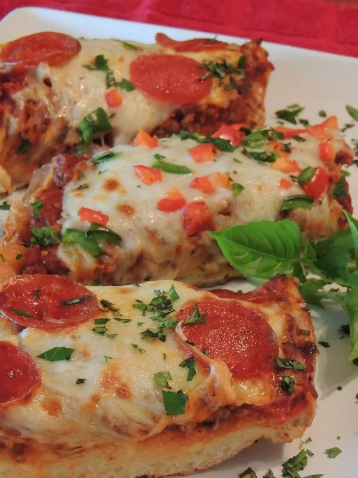 baked pizza on French bread with toppings.