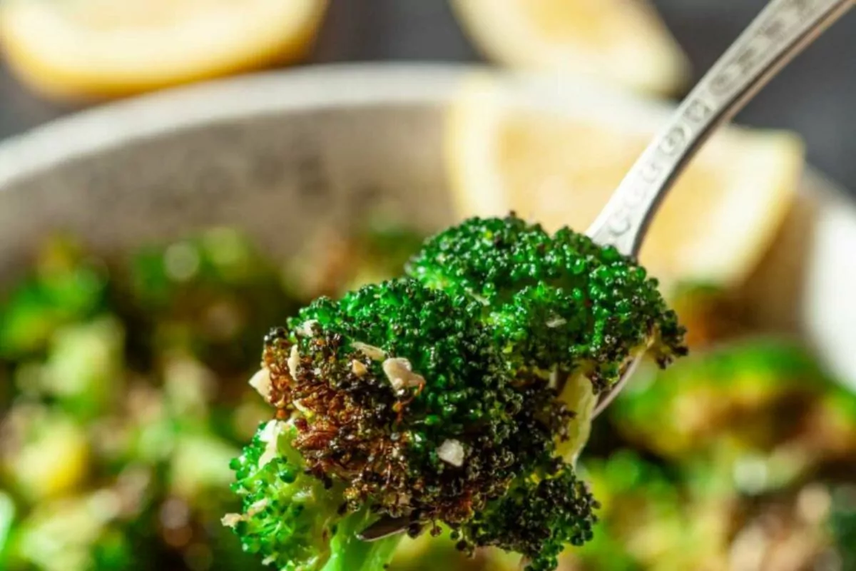 Roasted broccoli on a fork.