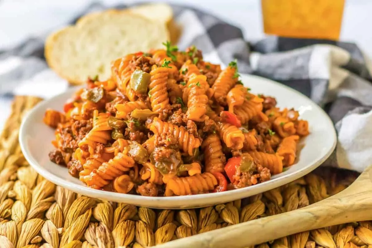 a bowl of pasta with sloppy joe meat and sauce.