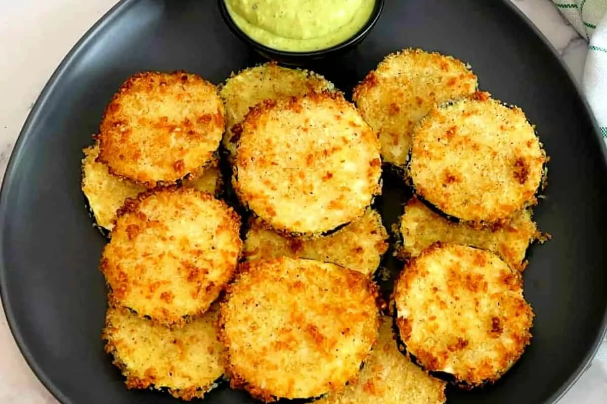 a plate of zucchini slices, fried in the air fryer.