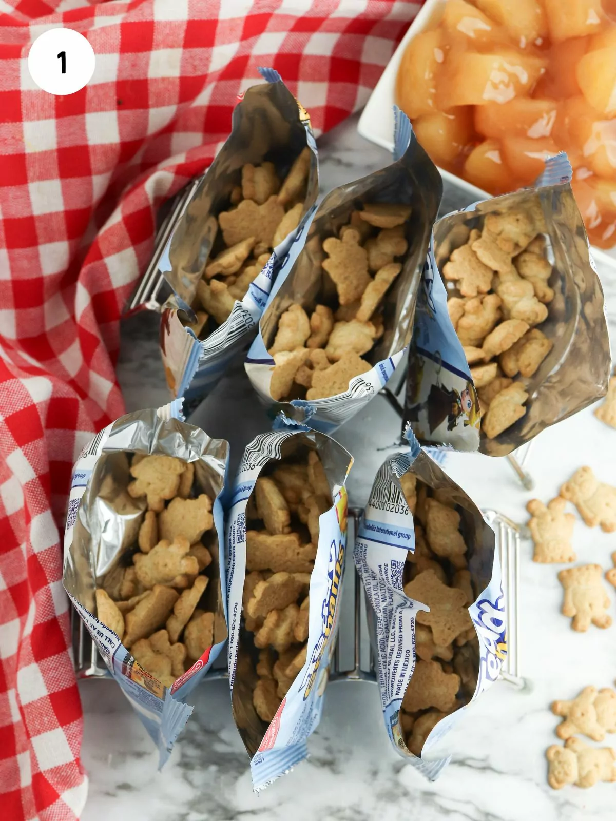 Open bags of teddy grahams set up to be filled