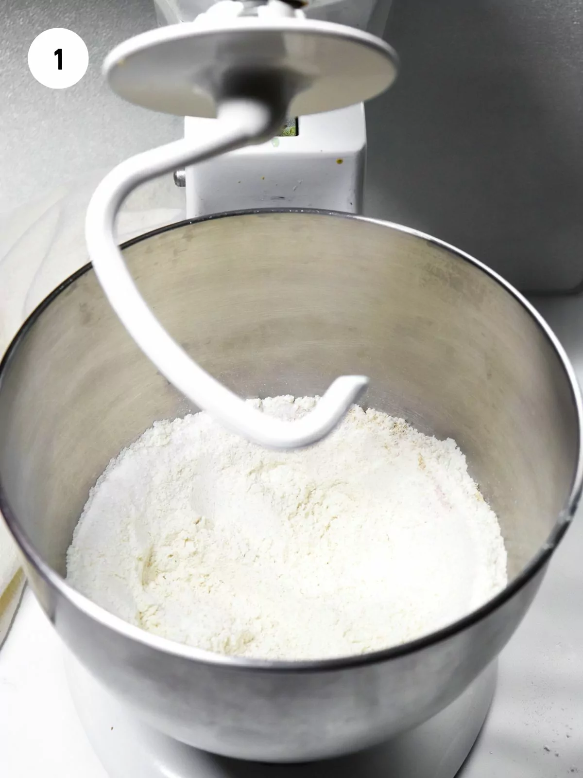 flour, sugar, yeast, and salt in large mixer fitted with a dough hook