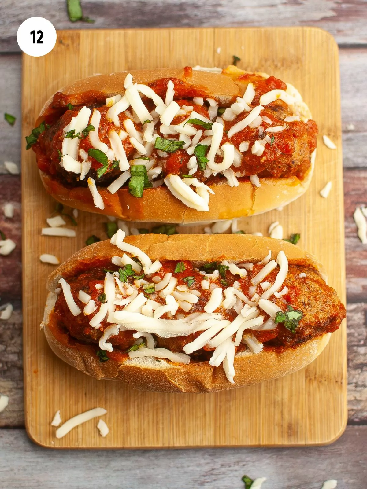 shredded mozzarella added on top of the meatball subs