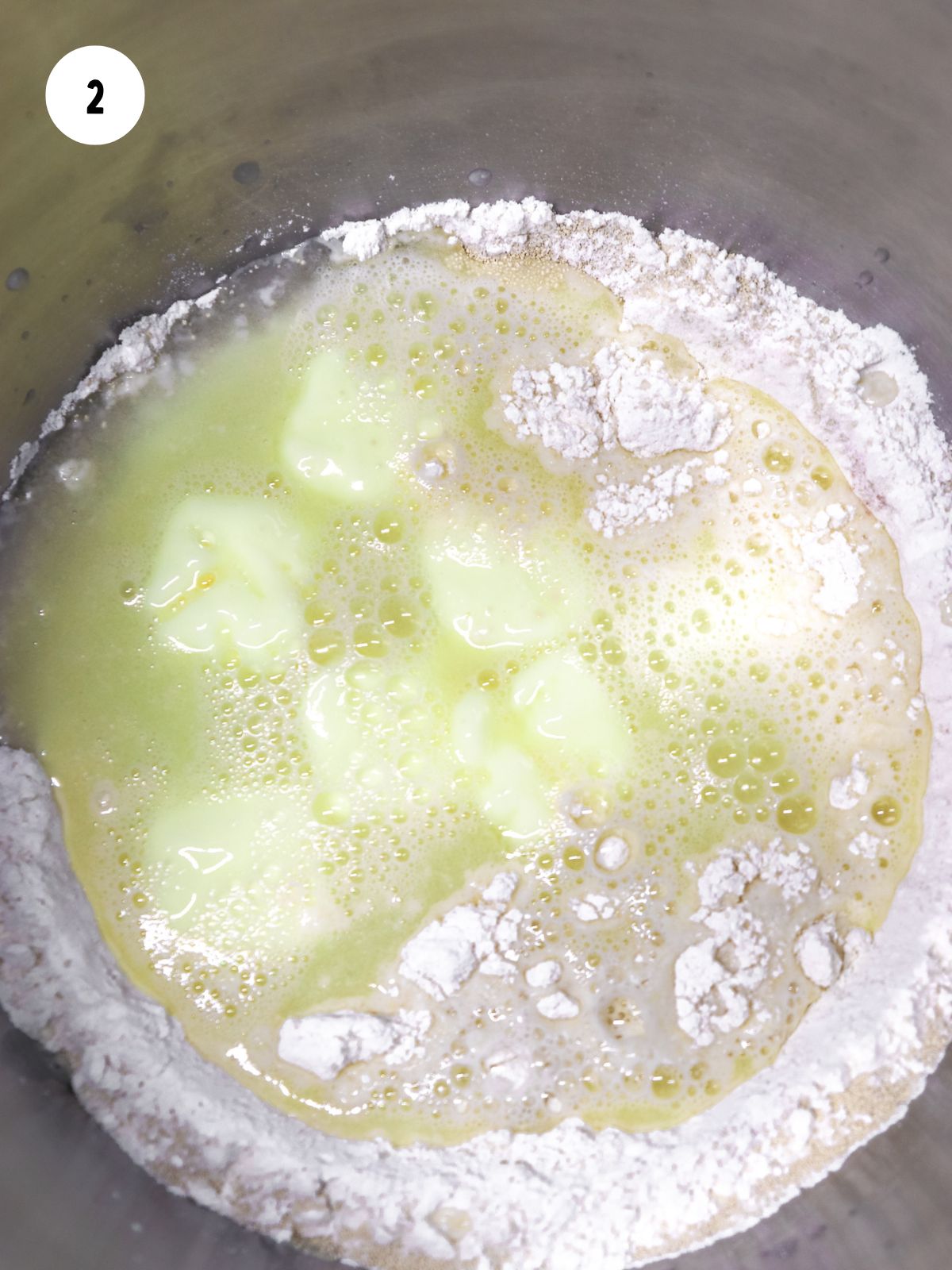 warm water and cubed butter added to mixing bowl