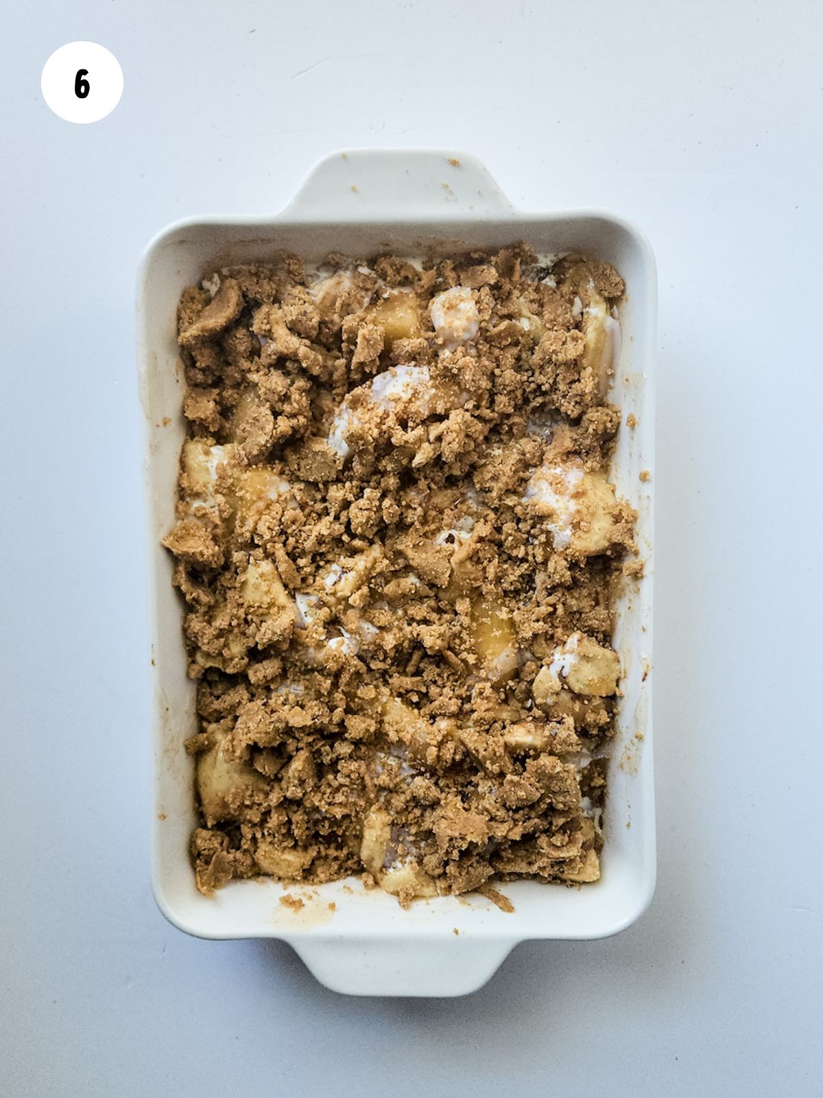 crumble topping added to the cinnamon roll casserole