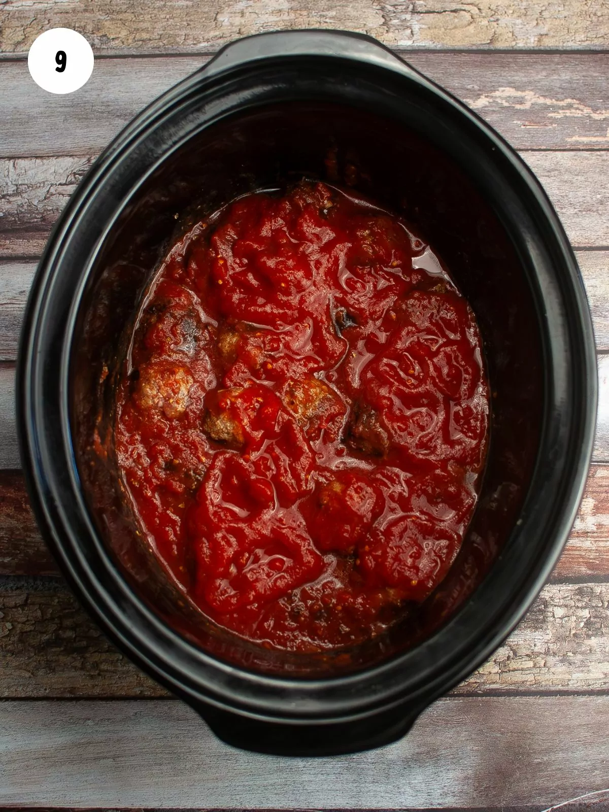 tomato sauce added on top of meatballs