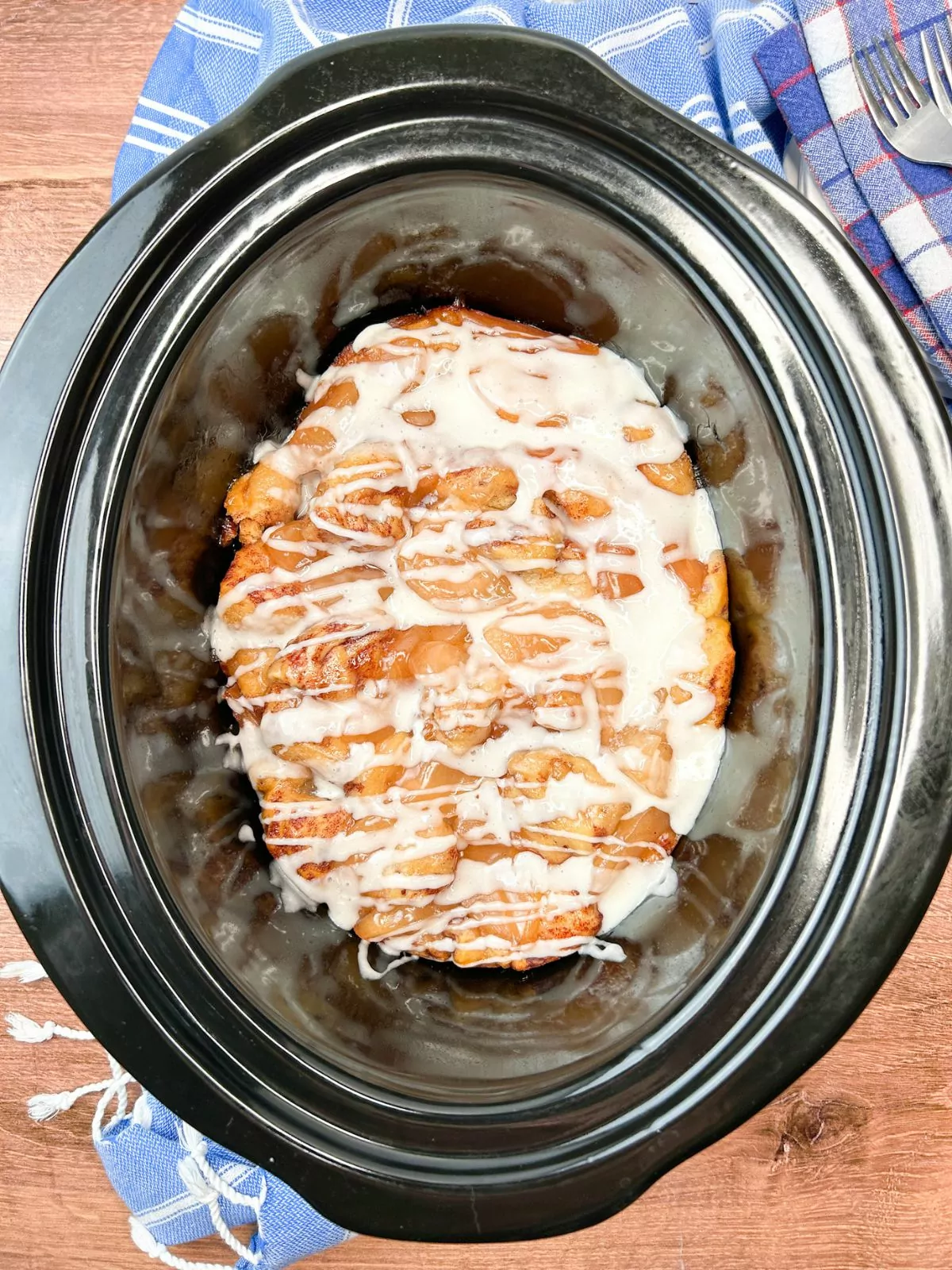 Apple Cinnamon Rolls with glaze in the crock pot