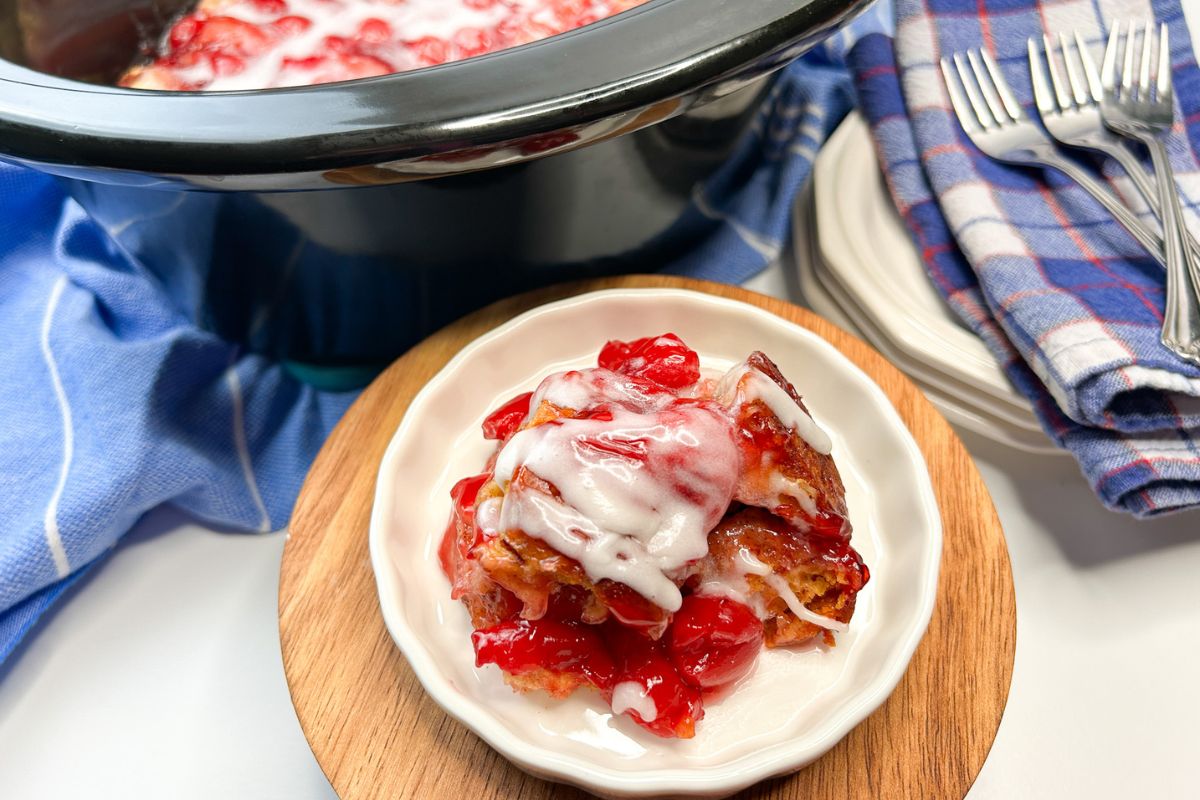 Cinnamon Rolls with Cherry Pie Filling served on a white plate