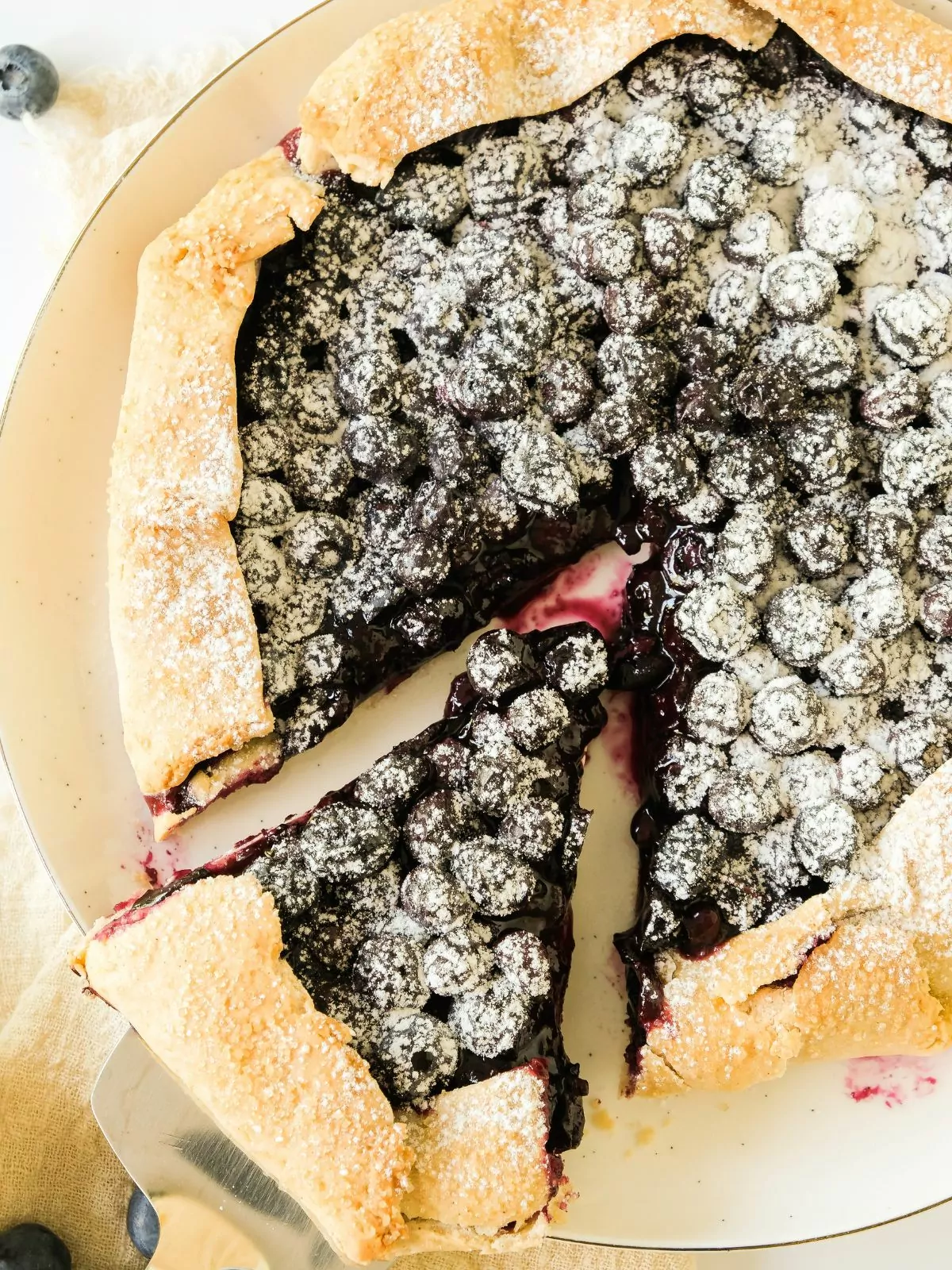 Blueberry Galette with a slice cut about to be served