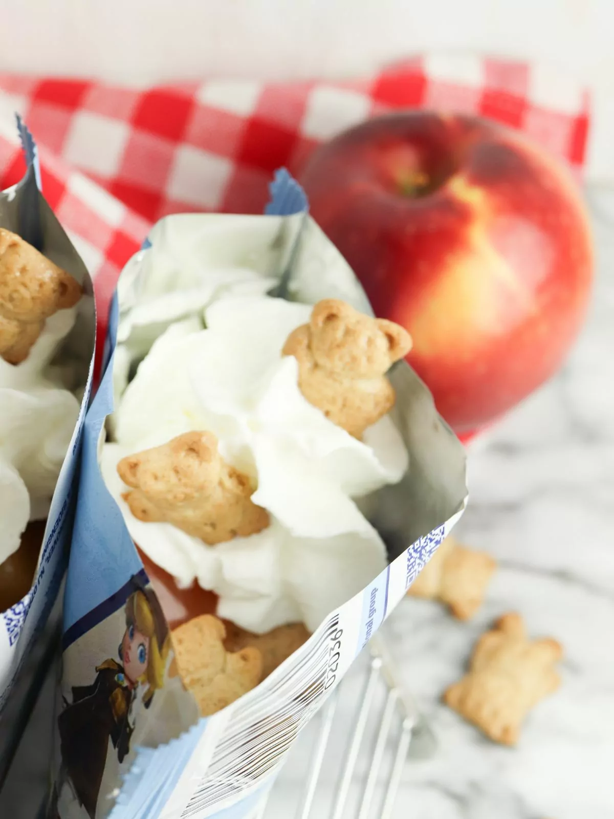 Walking Apple Pie in a bag of teddy grahams and an apple in the background