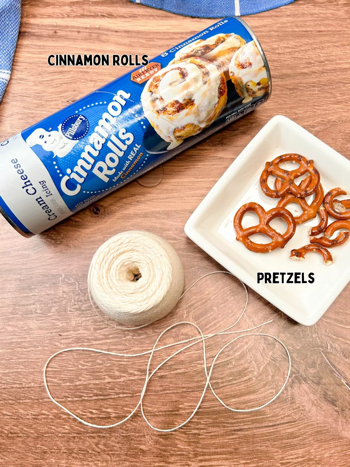 ingredients canned Pillsbury cinnamon rolls, pretzel twists and string.