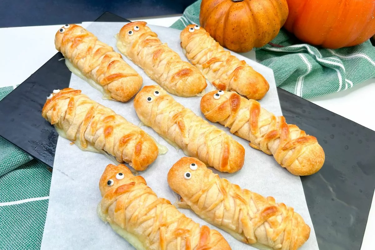 crescent roll cheese sticks decorated like mummies.