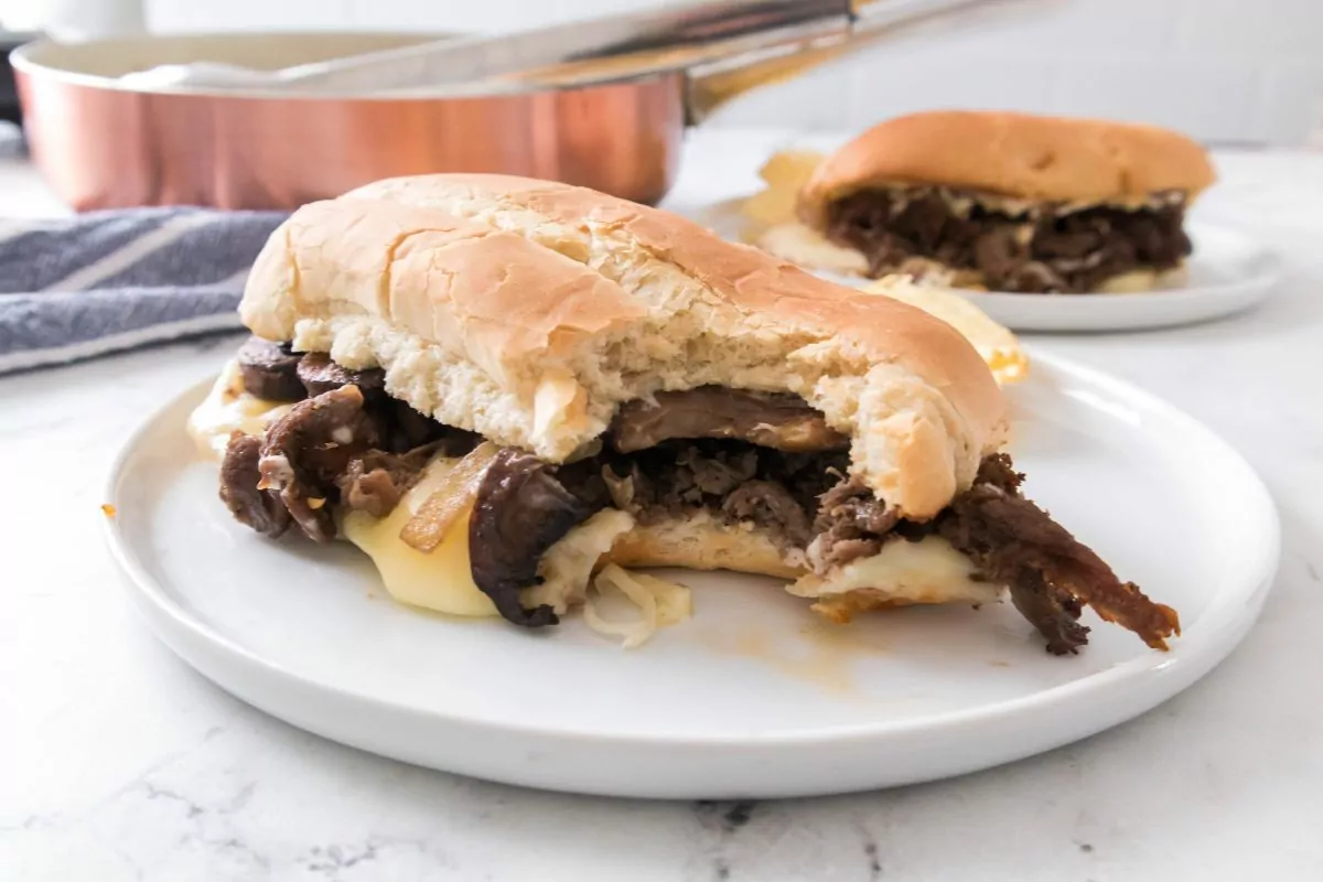 steak with onions and cheese sandwich.