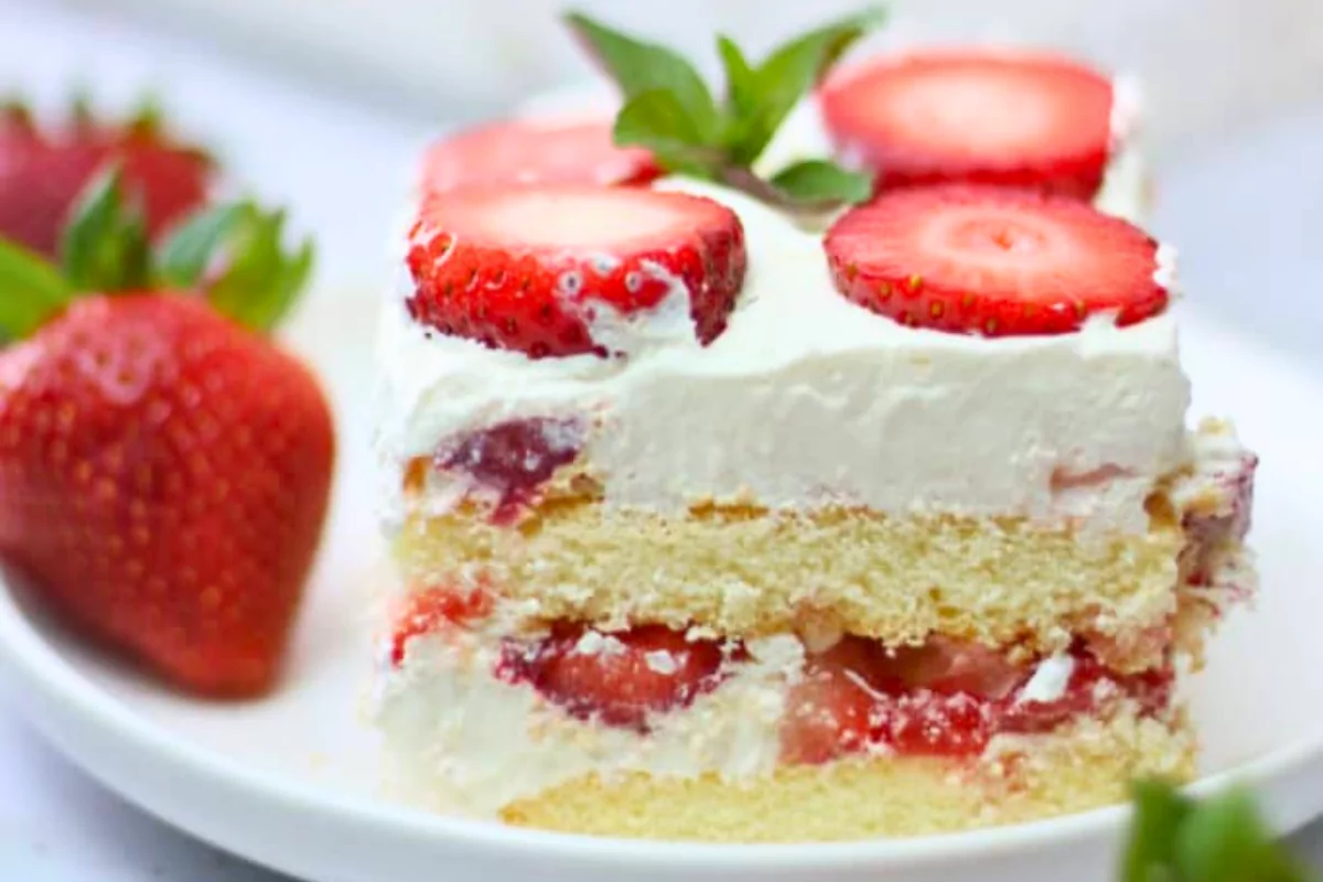 a cake in a plate with strawberry