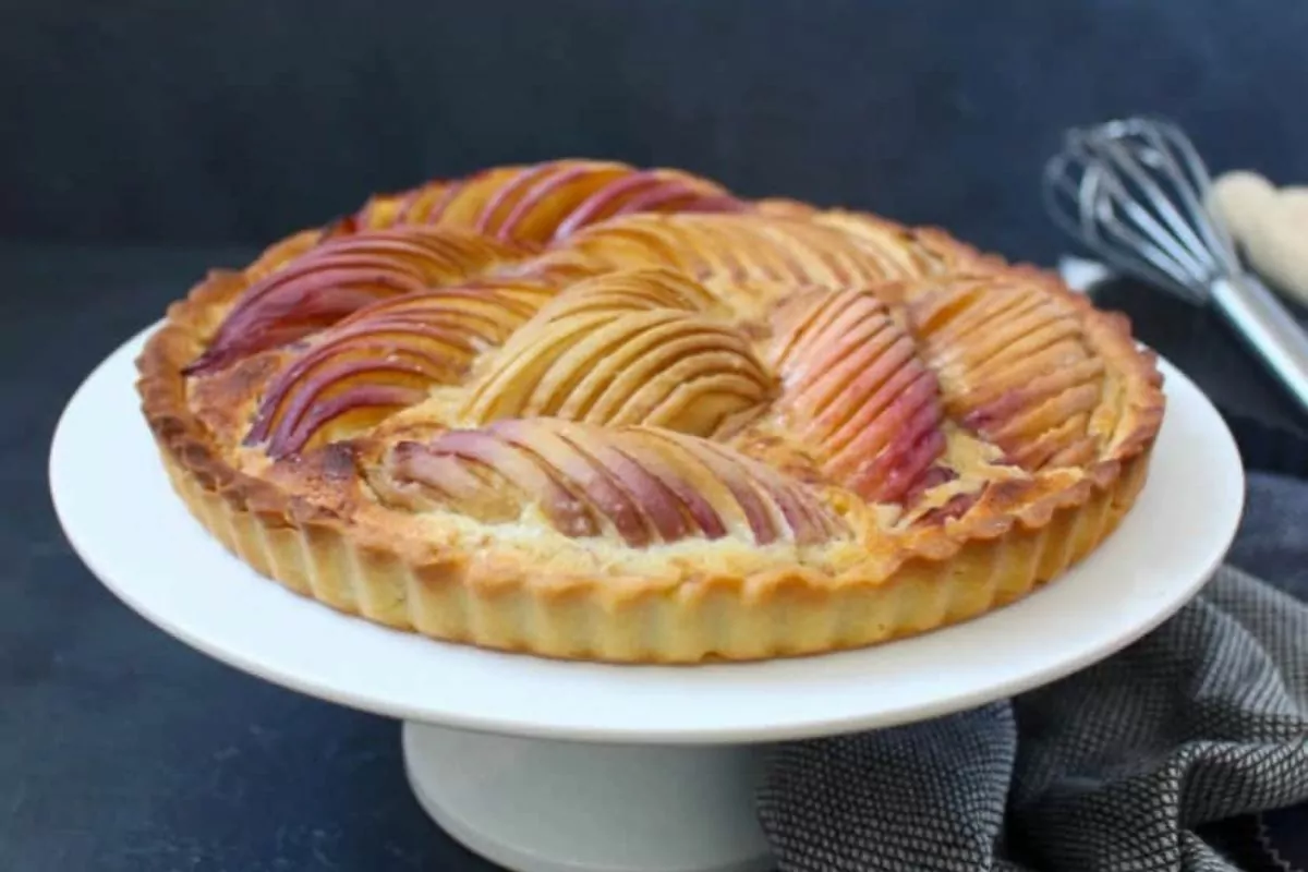 A tart made of layers of white peach slices.