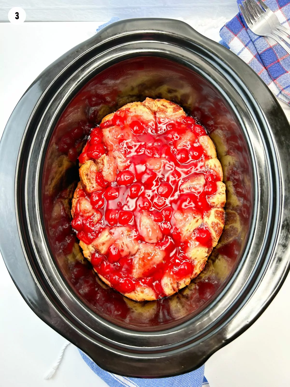 the cooked cherry cinnamon rolls in the slow cooker