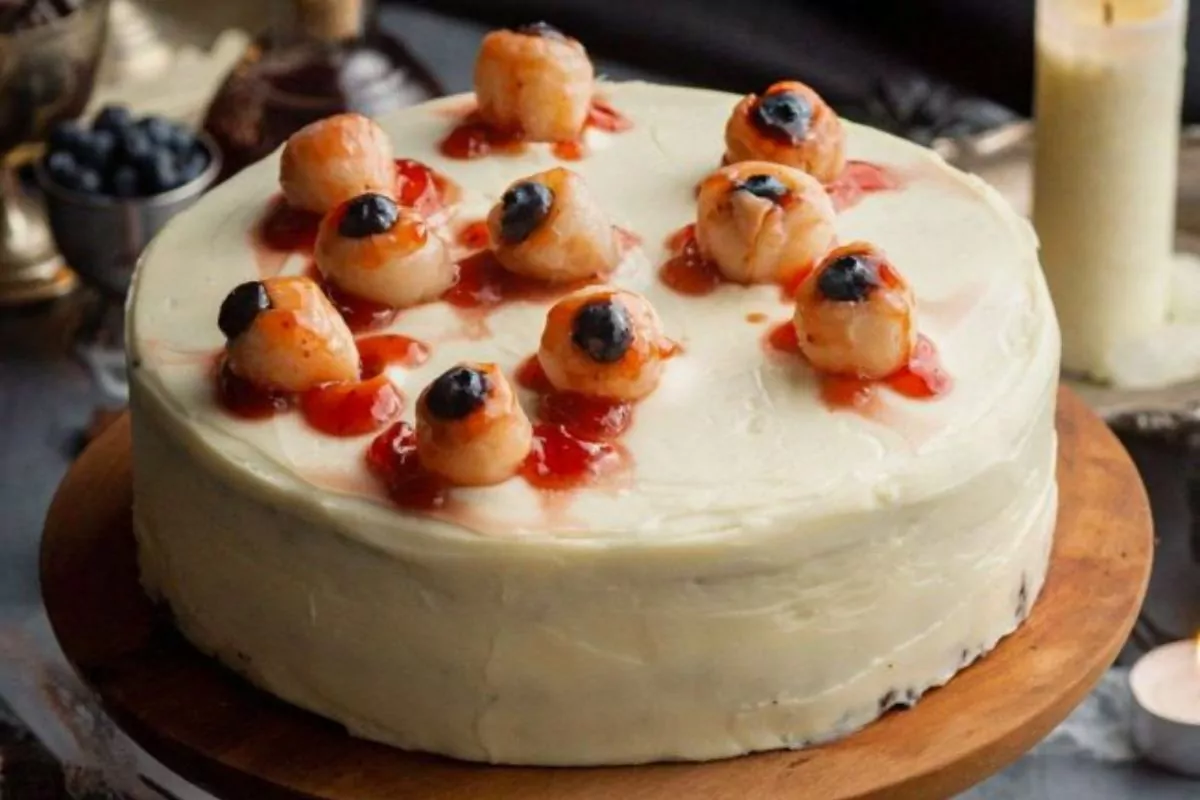 a chocolate layer cake with bloody lychee eyeballs over the top for halloween.