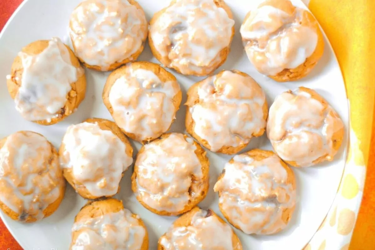 A platter of iced pumpkin cookies made from cake mix.