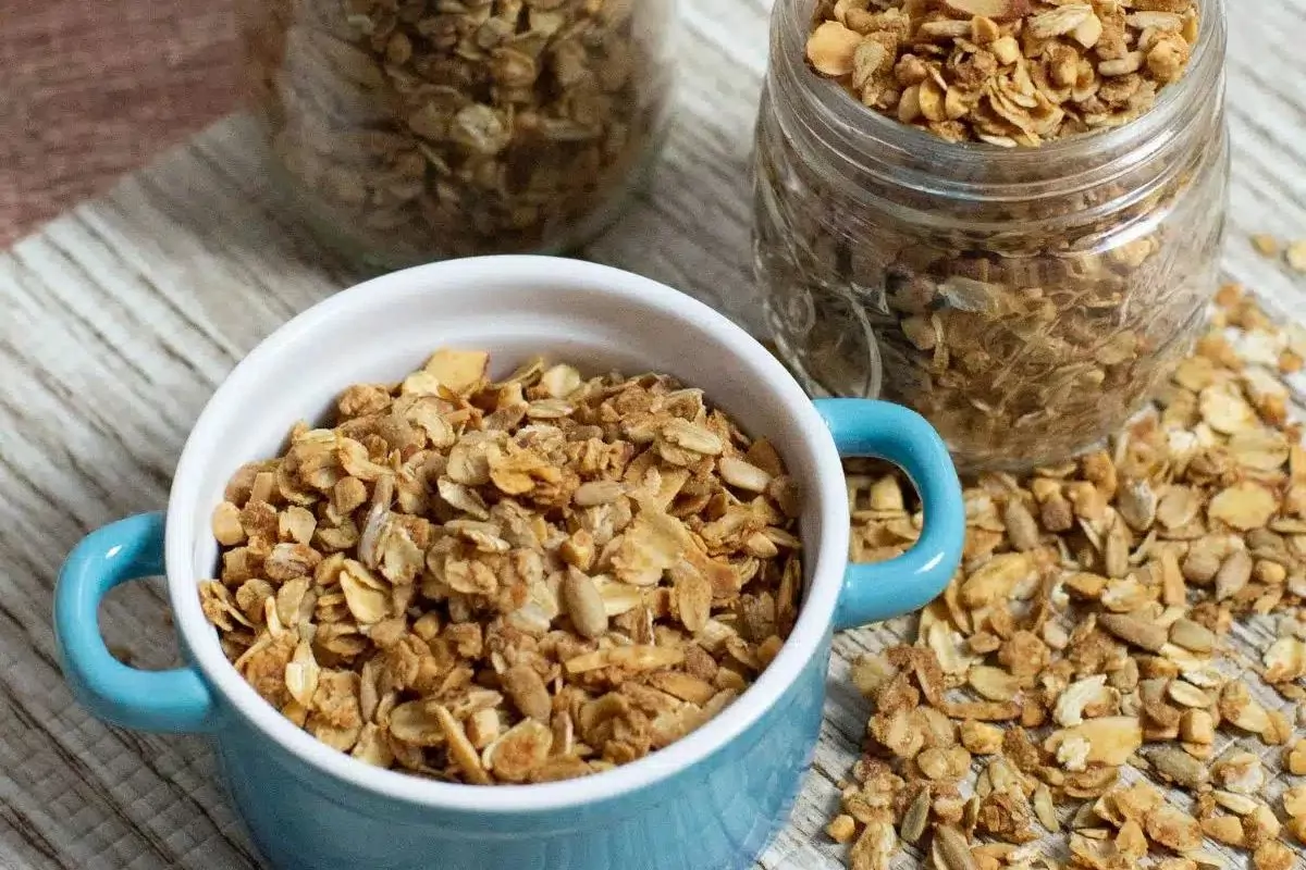 homemade granola in mason jars and blue bowl MSN.