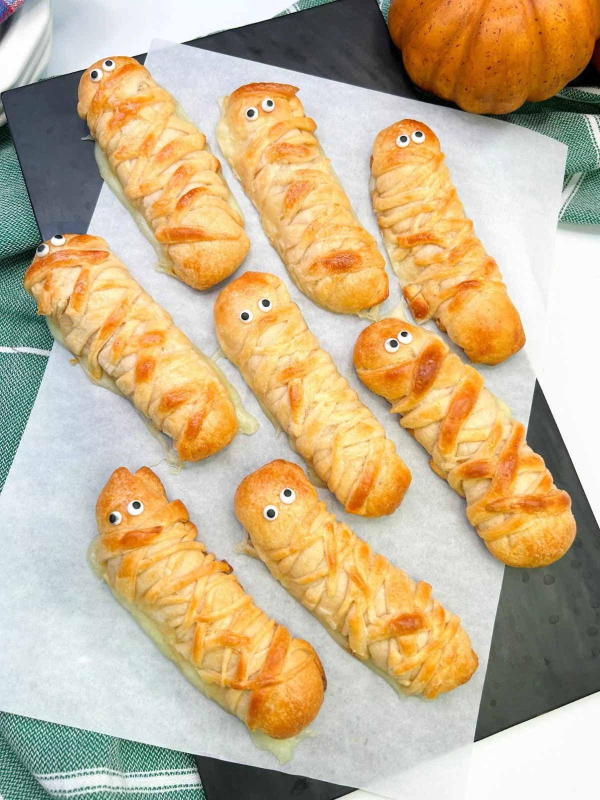 baked mummies made with crescent rolls, cheese and candy eyes.