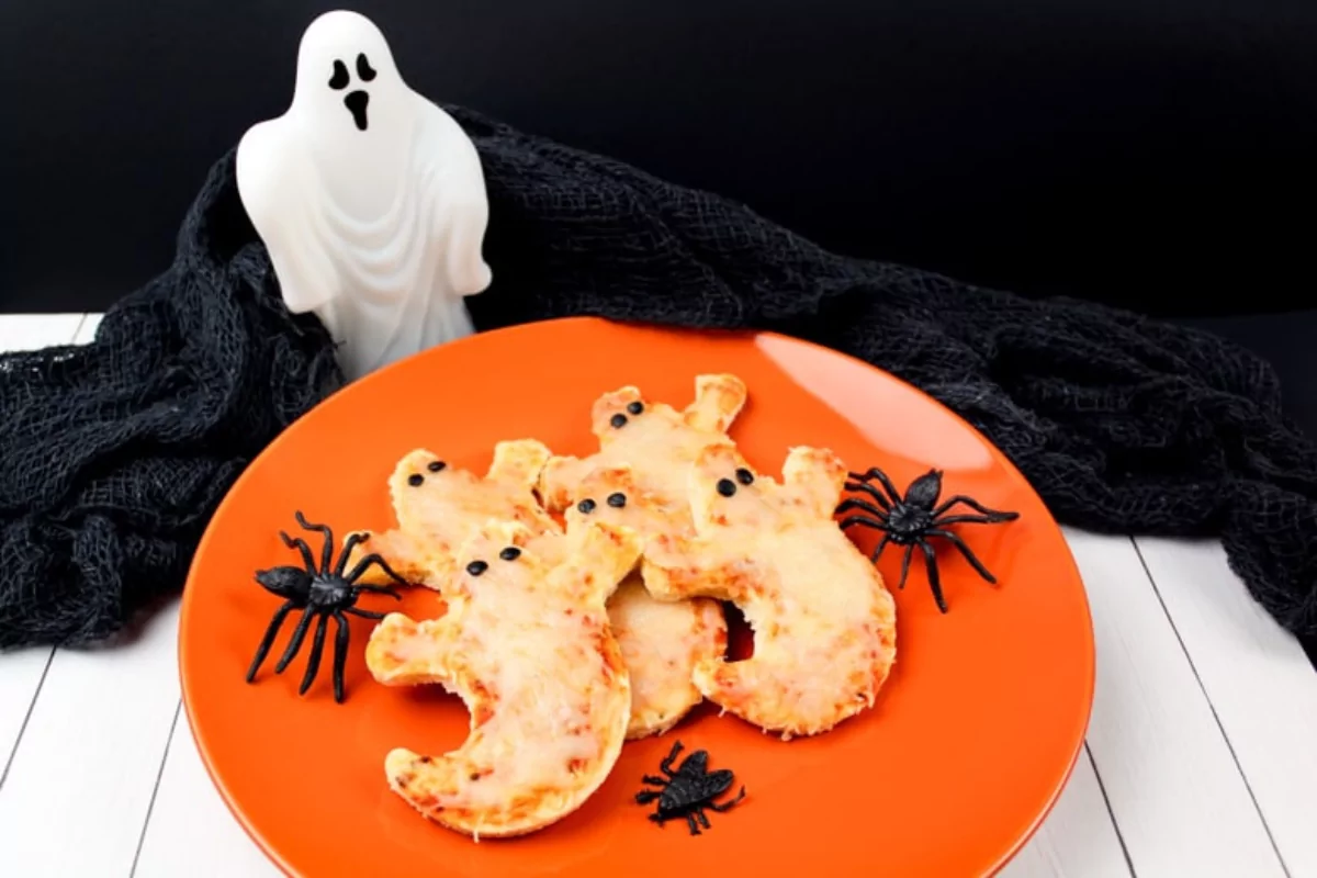 cheese pizzas made of a premade pizza crust, cut into a ghost shape.