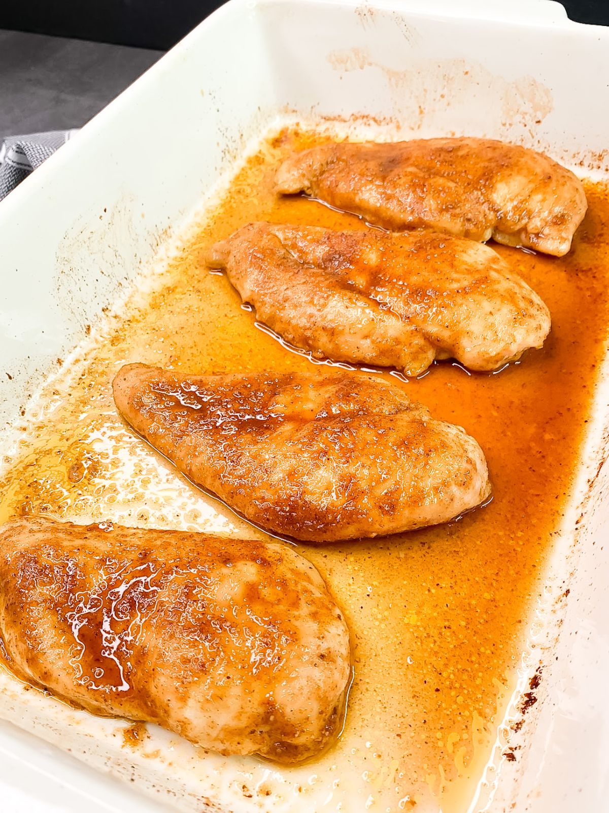 moist chicken cutlets baked and resting.