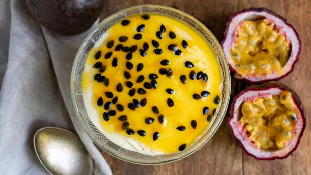 Dishes of passion fruit mousse with passion fruit over the top