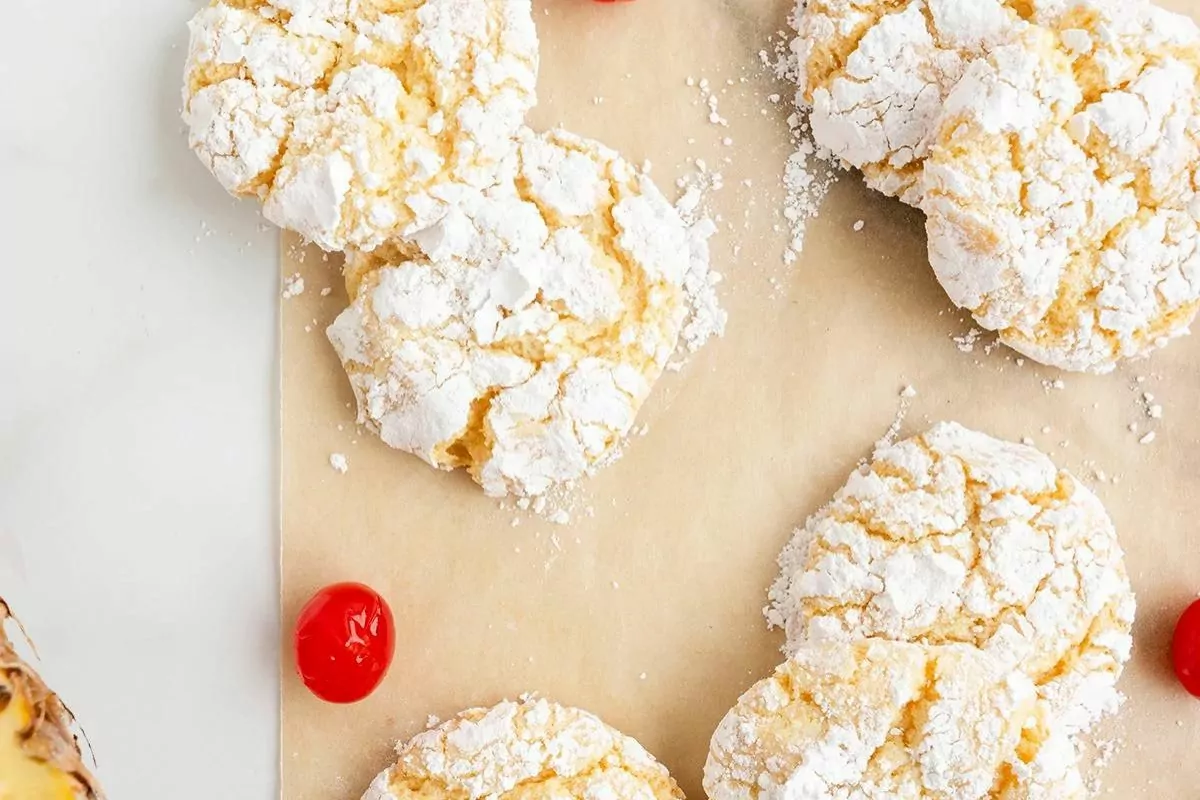 Pineapple cake mix cookies with powdered sugar coating.