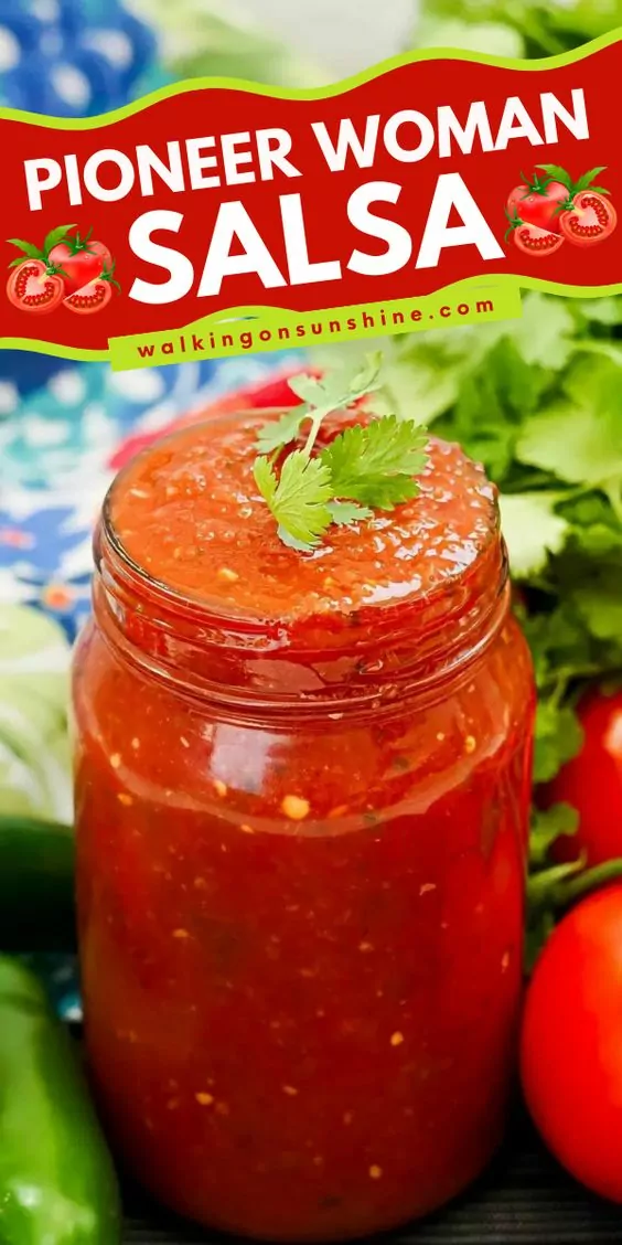 A clear mason jar filled with chunky, vibrant red salsa. Small pieces of tomato, onion, and pepper are visible throughout.