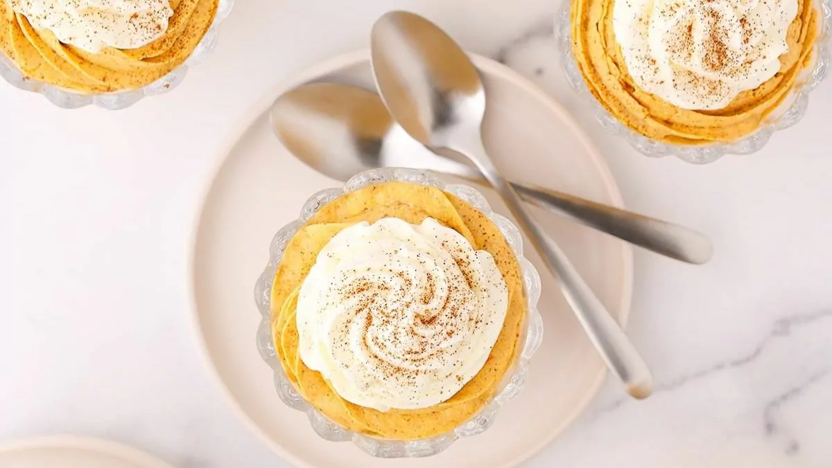 an overhead view of dishes of creamy whipped pumpkin mousse.