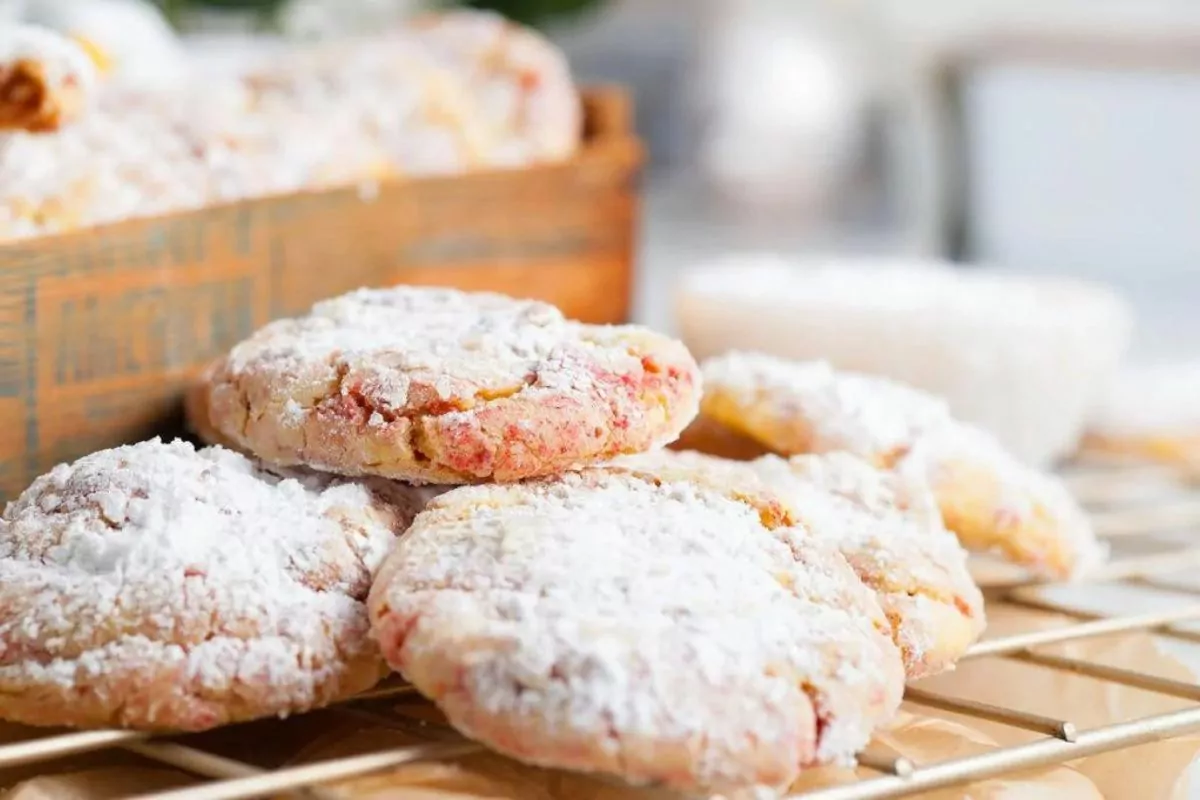 A plate of strawberry lemon cookies dusted with powdered sugar.